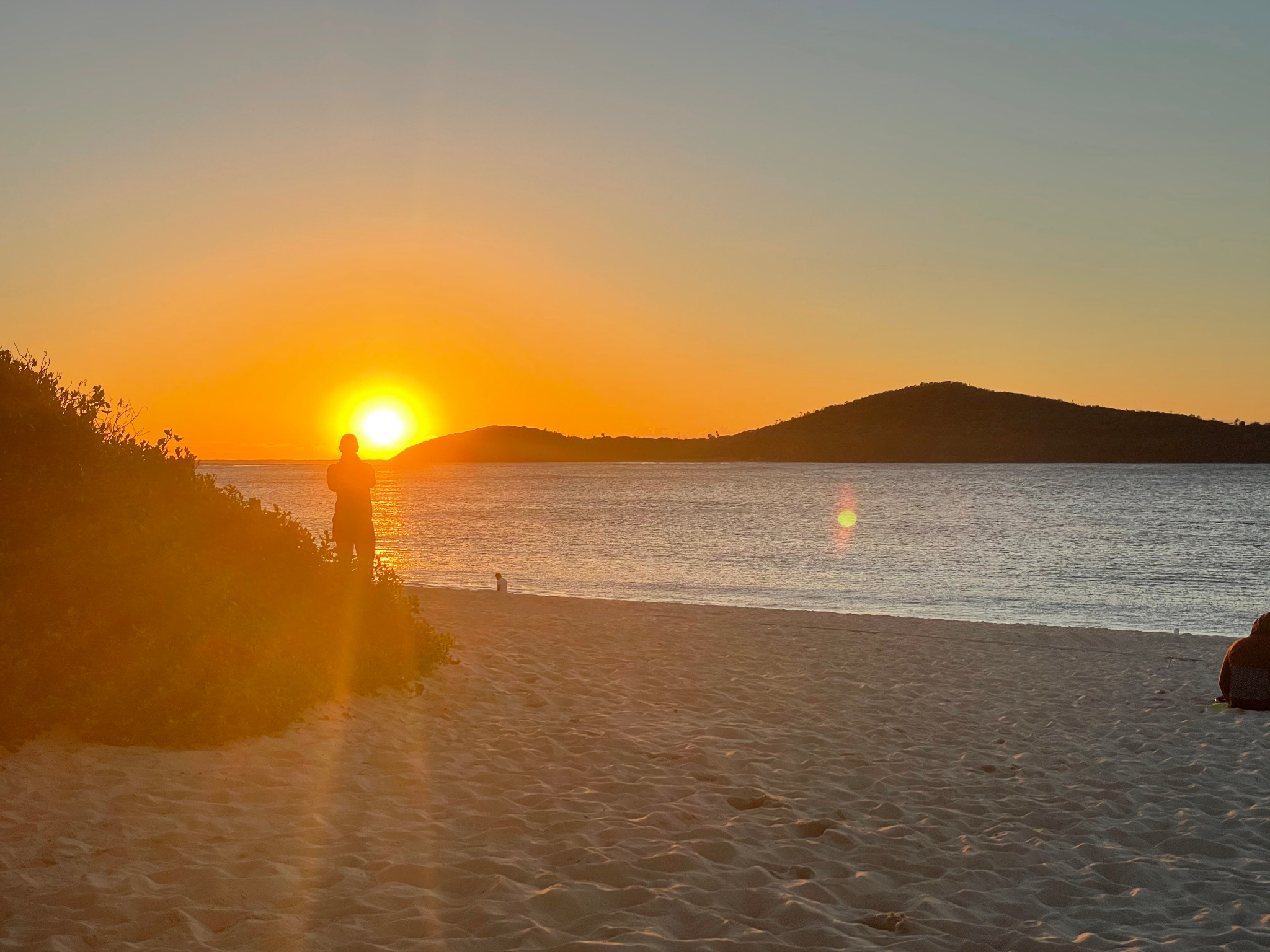 Sunset over Fingal Beach and the surrounding headland